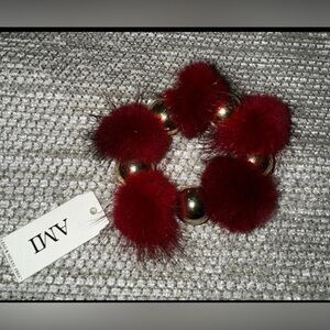 BNWT Ami Red fuzzy feather Stretch bracelet with gold tone accents